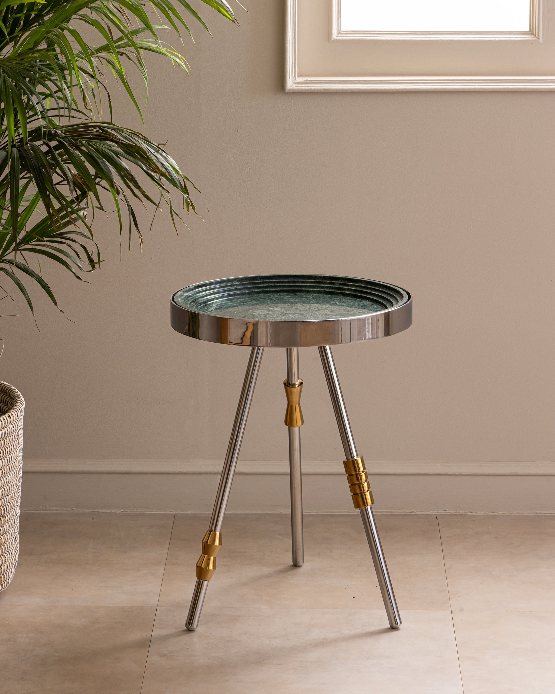 Sculptural Stainless Steel Accent Table in living room