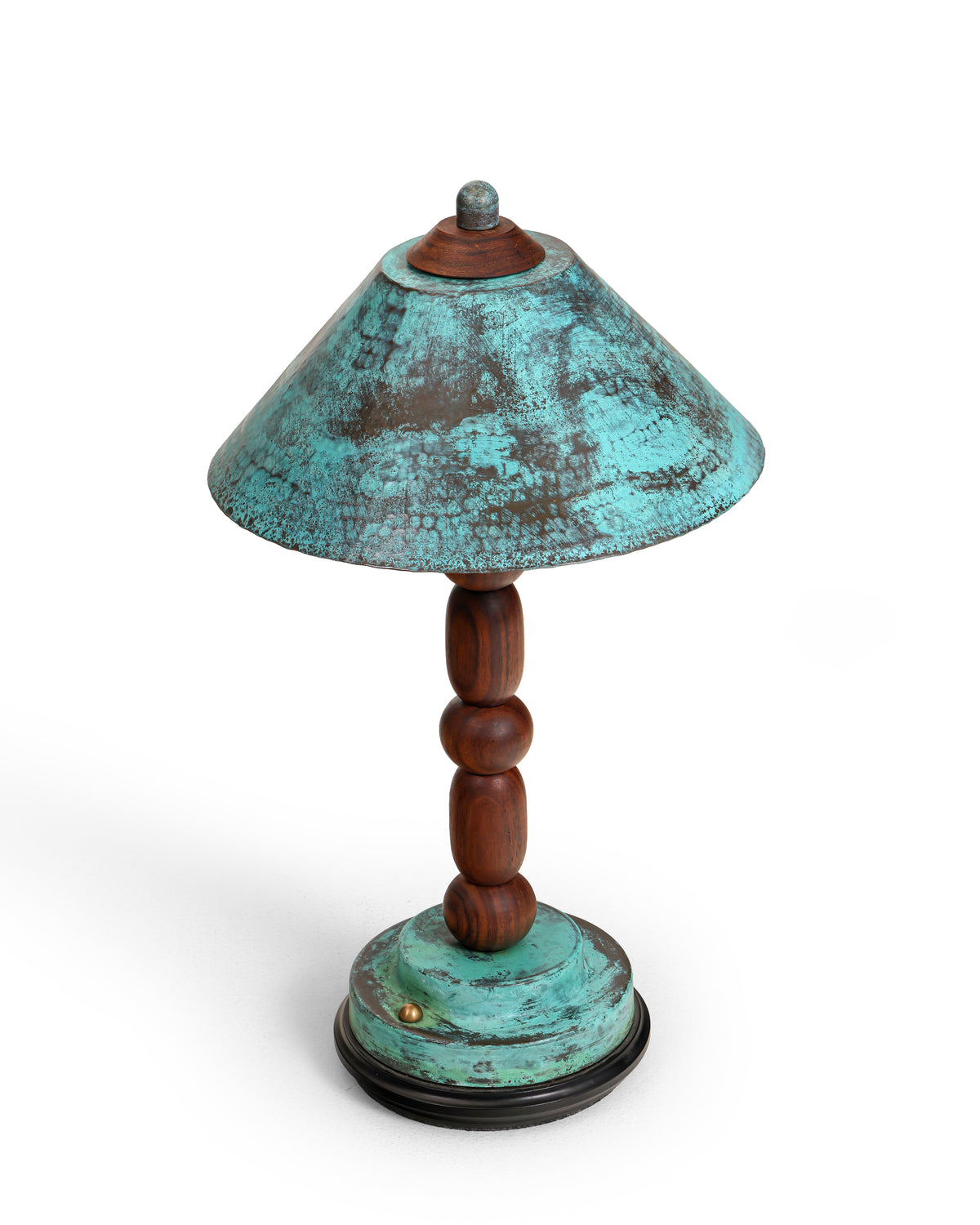 Totem II lamp three-quarter view showing the conical brass shade and stepped base