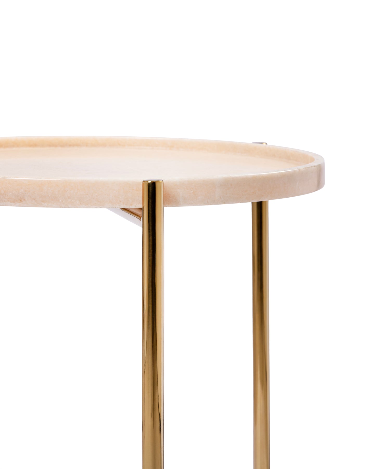Detail of the Tri Metal side table showing the marble tray's raised lip meeting the metal legs